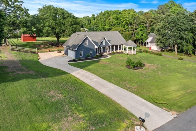 300 Olde Wick Trl, Hoschton, GA 30548 - view of front of property featuring a garage, asphalt driveway, and a porch