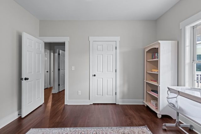 300 Olde Wick Trl, Hoschton, GA 30548 - unfurnished bedroom with wood finished floors and baseboards