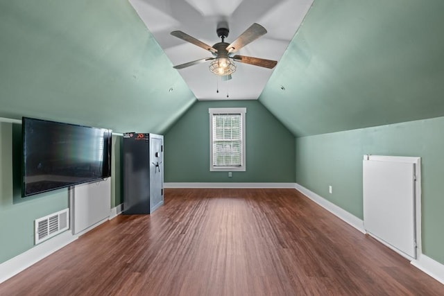 300 Olde Wick Trl, Hoschton, GA 30548 - additional living space with wood finished floors, ceiling fan, baseboards, and vaulted ceiling