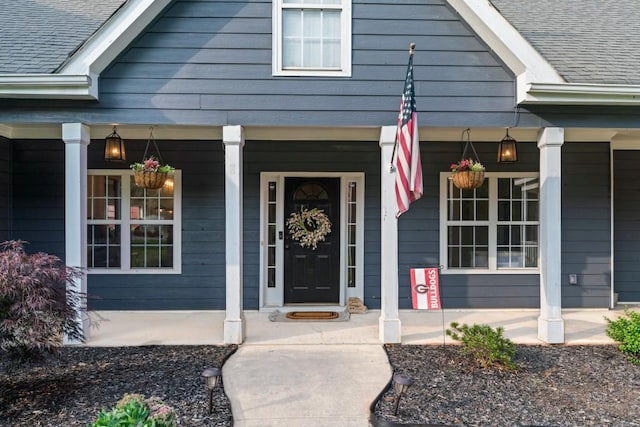 300 Olde Wick Trl, Hoschton, GA 30548 - doorway to property with covered porch and a shingled roof