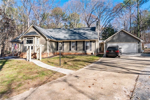 view of front of home featuring a garage and a front lawn