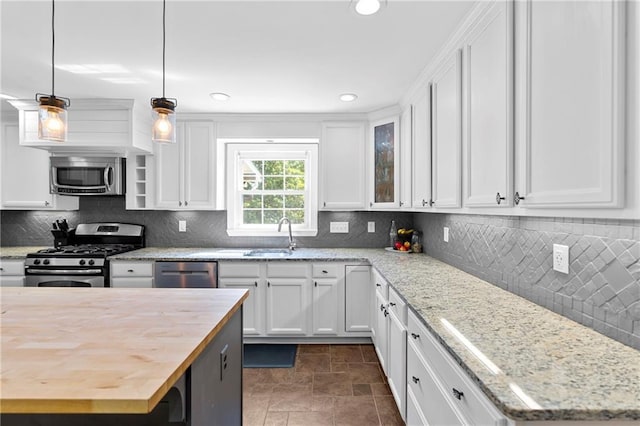 75 Auburn Rd, Auburn, GA 30011 - kitchen with appliances with stainless steel finishes, a sink, white cabinets, butcher block countertops, and recessed lighting