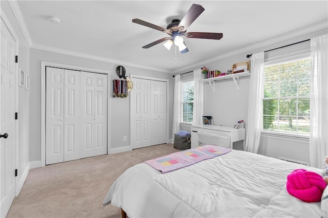 75 Auburn Rd, Auburn, GA 30011 - bedroom with carpet flooring, multiple closets, crown molding, baseboards, and a ceiling fan