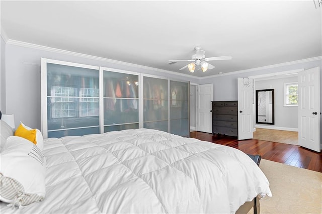 75 Auburn Rd, Auburn, GA 30011 - bedroom featuring wood-type flooring, ornamental molding, ceiling fan, and baseboards