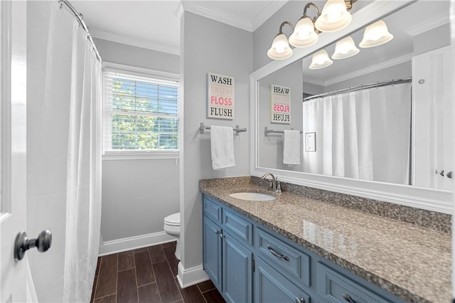 75 Auburn Rd, Auburn, GA 30011 - full bathroom with vanity, toilet, baseboards, wood tiled floors, and ornamental molding