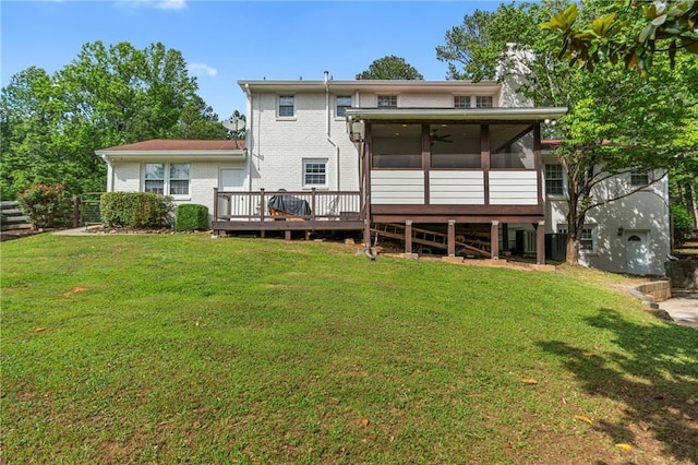 75 Auburn Rd, Auburn, GA 30011 - back of house featuring a sunroom, a lawn, brick siding, a deck, and central AC