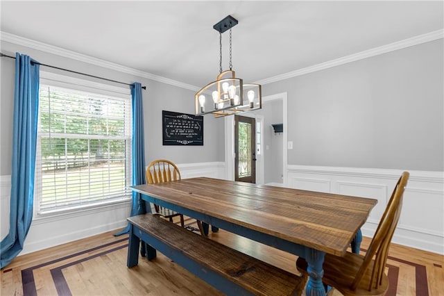 75 Auburn Rd, Auburn, GA 30011 - dining room with a chandelier, healthy amount of natural light, wainscoting, ornamental molding, and wood finished floors