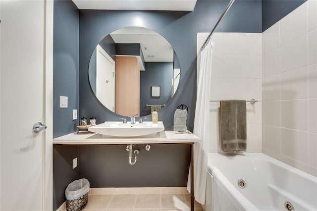 bathroom with tile patterned flooring, sink, and shower / bath combo