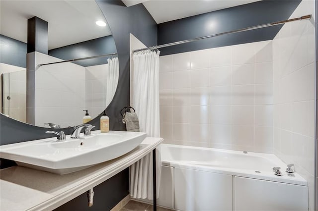 bathroom with sink and shower / tub combo