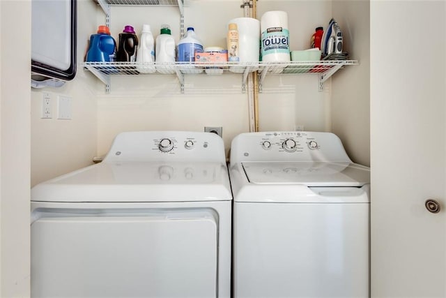 laundry room featuring washing machine and clothes dryer