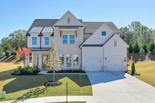 view of front of home with a garage and a front yard