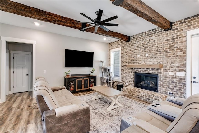 340 Taylor Path, Dallas, GA 30157 - living area with beam ceiling, wood finished floors, a brick fireplace, ceiling fan, and recessed lighting