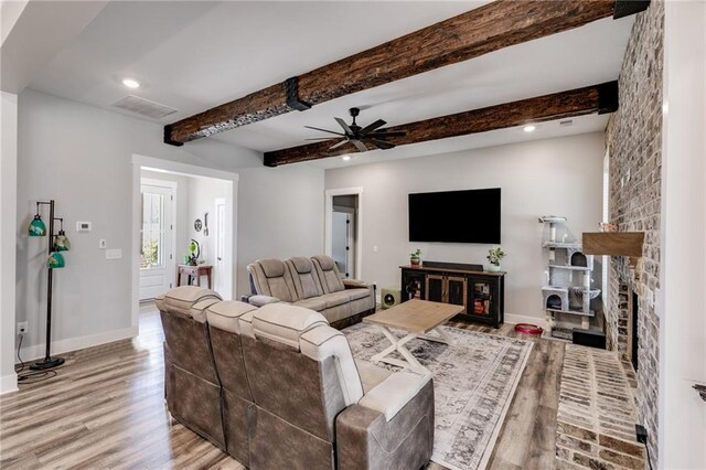 340 Taylor Path, Dallas, GA 30157 - living room featuring a ceiling fan, wood finished floors, beamed ceiling, baseboards, and visible vents