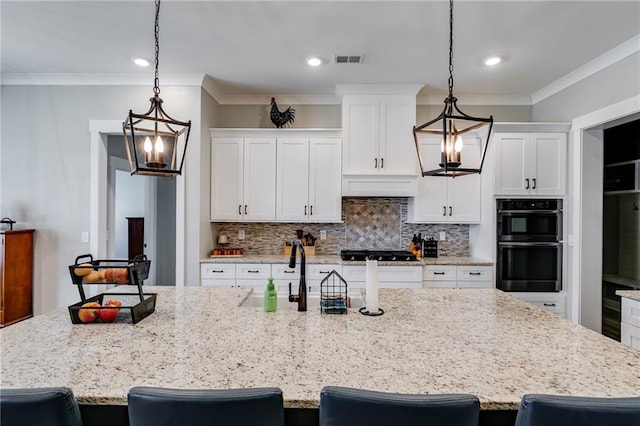 340 Taylor Path, Dallas, GA 30157 - kitchen featuring visible vents, a chandelier, black gas stovetop, double wall oven, and tasteful backsplash