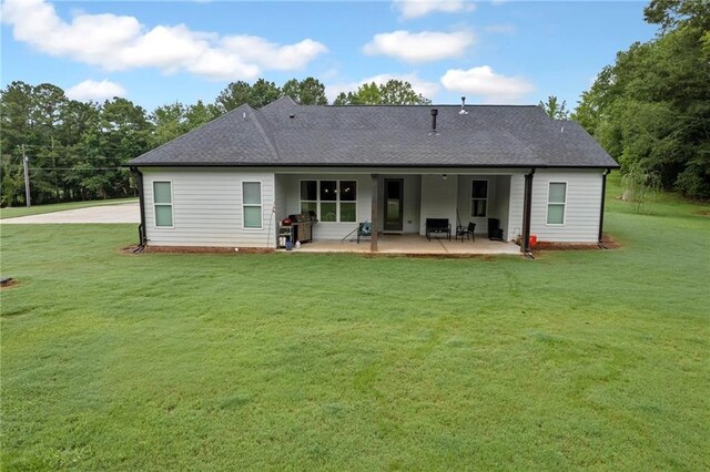 340 Taylor Path, Dallas, GA 30157 - back of property with a shingled roof, a yard, and a patio