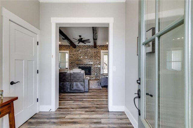340 Taylor Path, Dallas, GA 30157 - entryway with beamed ceiling, wood finished floors, ceiling fan, and a fireplace