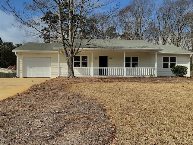 ranch-style house with a porch, an attached garage, and concrete driveway