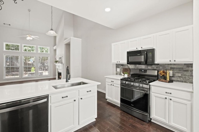 kitchen featuring tasteful backsplash, white cabinetry, sink, and appliances with stainless steel finishes