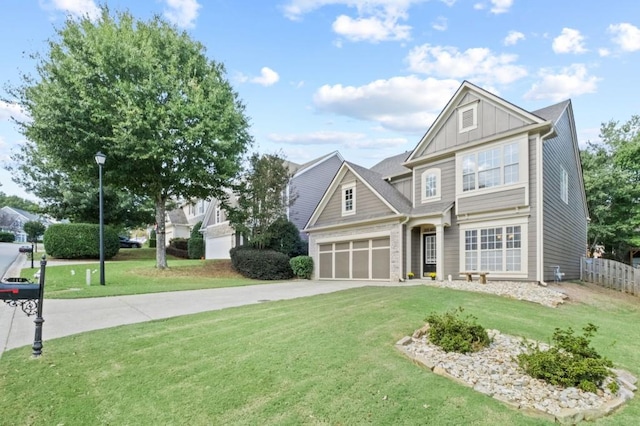 view of front of house with a front yard and a garage