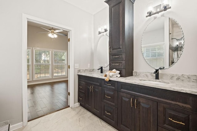 bathroom with ceiling fan and vanity