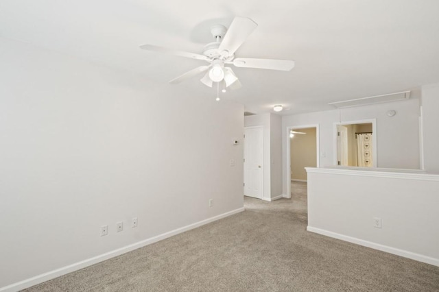 unfurnished room with ceiling fan and light carpet