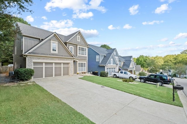 view of front of property with a front lawn and a garage