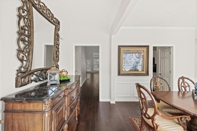 dining room featuring crown molding and dark wood-type flooring