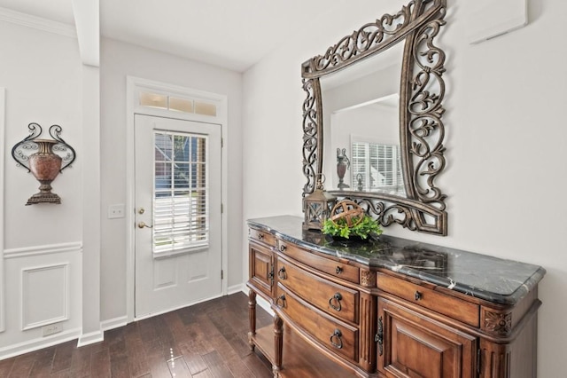 doorway with dark hardwood / wood-style flooring