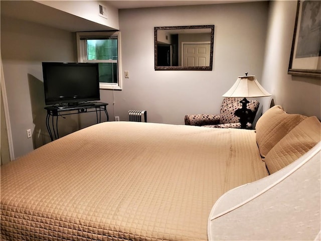 bedroom with radiator heating unit