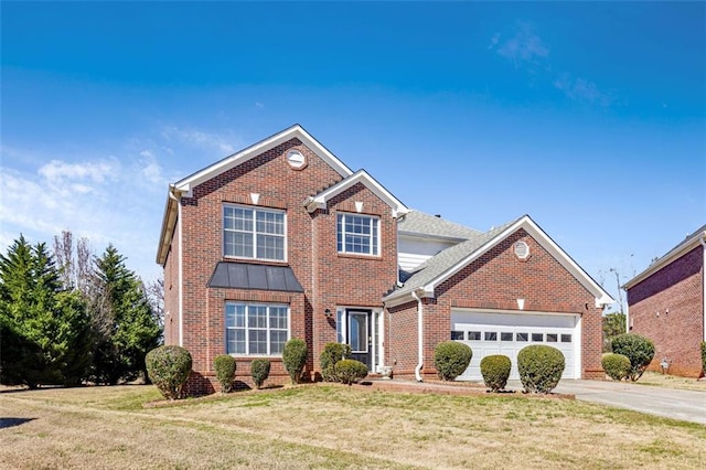 traditional-style home with driveway, a garage, a front lawn, and brick siding