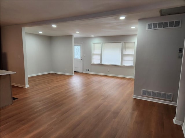 unfurnished living room with dark hardwood / wood-style floors