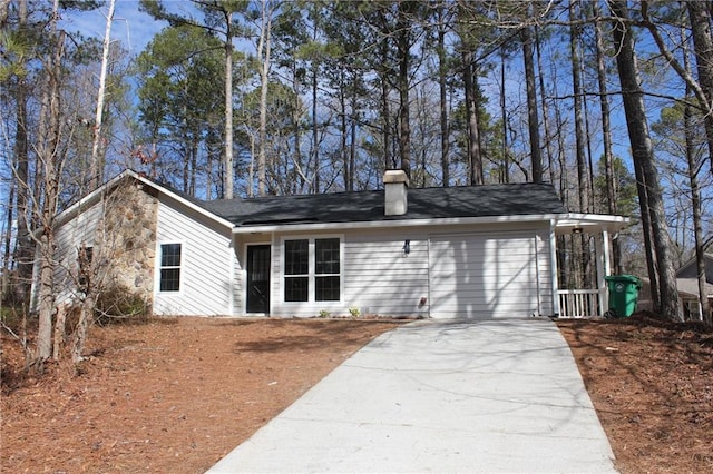 rear view of house with a garage