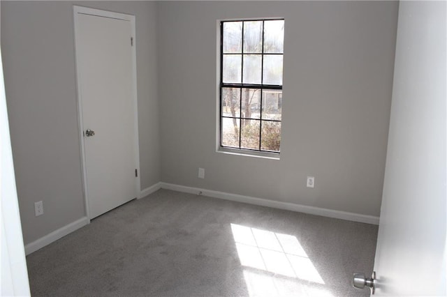 unfurnished room with carpet floors