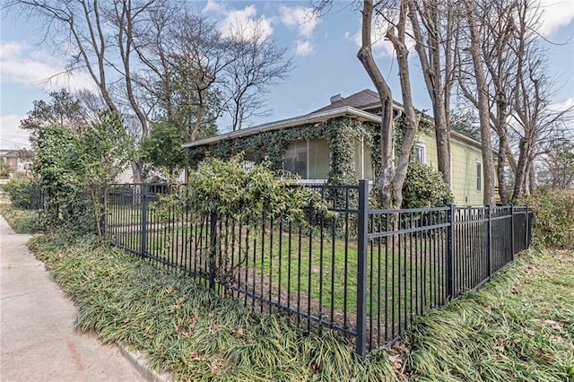 exterior space with a fenced front yard