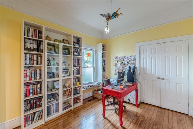 office featuring hardwood / wood-style floors and ornamental molding