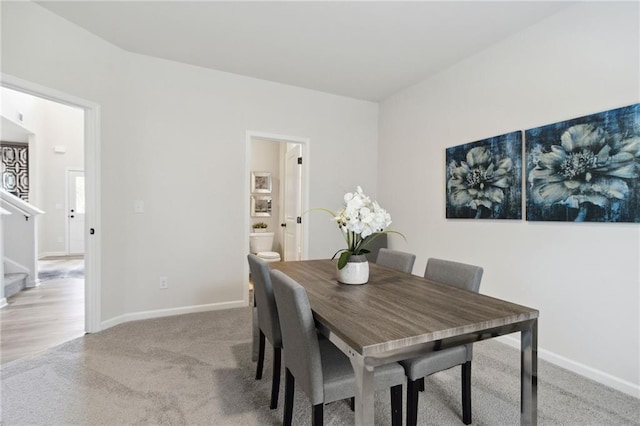 view of carpeted dining area