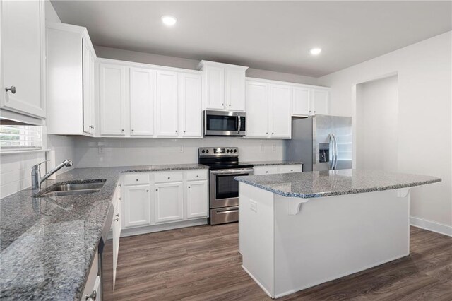 33 N Village Cir, Rydal, GA 30171 - kitchen with appliances with stainless steel finishes, a sink, a center island, white cabinets, and recessed lighting