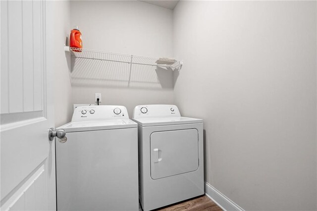33 N Village Cir, Rydal, GA 30171 - laundry area with washer and dryer, baseboards, and wood finished floors