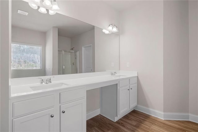 33 N Village Cir, Rydal, GA 30171 - bathroom featuring wood finished floors, a stall shower, baseboards, and double vanity