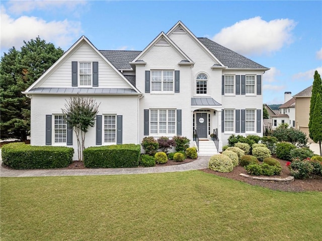 200 Glen Wood Pl, Canton, GA 30114 - colonial inspired home with a front lawn, a standing seam roof, brick siding, a metal roof, and roof with shingles