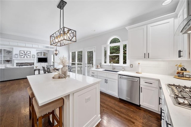 200 Glen Wood Pl, Canton, GA 30114 - kitchen with stainless steel appliances, a center island, white cabinets, open floor plan, and a breakfast bar