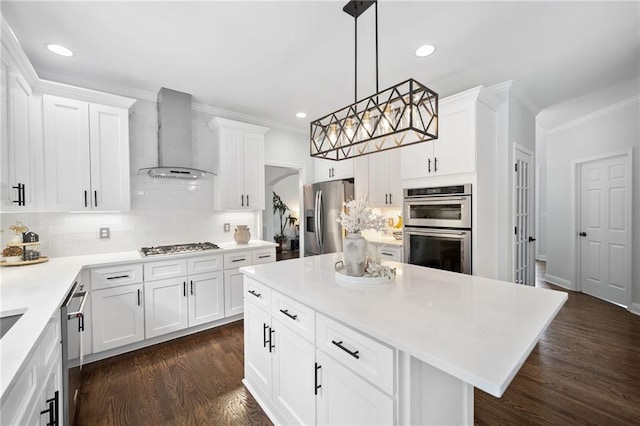 200 Glen Wood Pl, Canton, GA 30114 - kitchen featuring stainless steel appliances, wall chimney exhaust hood, tasteful backsplash, recessed lighting, and ornamental molding
