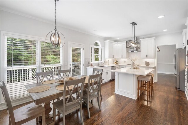 200 Glen Wood Pl, Canton, GA 30114 - dining area with dark wood-style flooring, a chandelier, ornamental molding, and recessed lighting