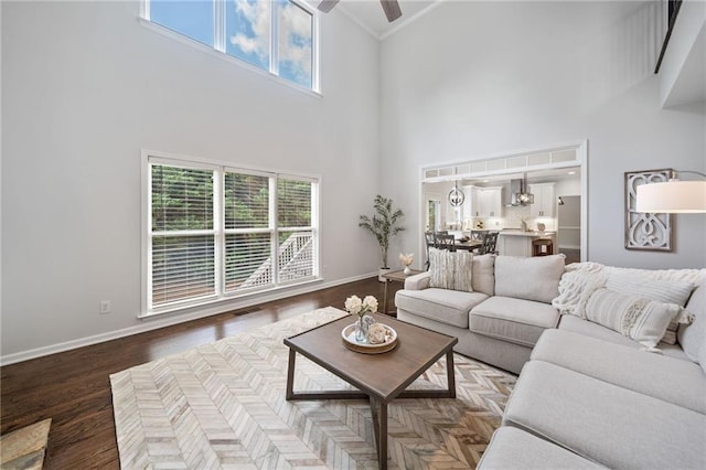 200 Glen Wood Pl, Canton, GA 30114 - living room with a high ceiling, ceiling fan, crown molding, and wood finished floors