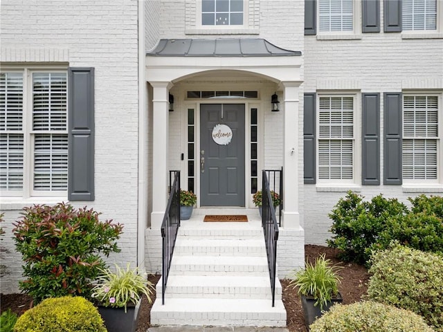 200 Glen Wood Pl, Canton, GA 30114 - view of exterior entry with brick siding and a standing seam roof