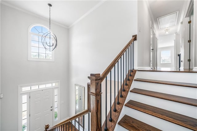 200 Glen Wood Pl, Canton, GA 30114 - foyer entrance with crown molding, a towering ceiling, and a chandelier