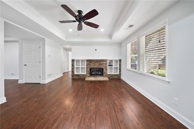 200 Glen Wood Pl, Canton, GA 30114 - unfurnished living room featuring a tray ceiling, hardwood / wood-style flooring, a fireplace, a ceiling fan, and crown molding