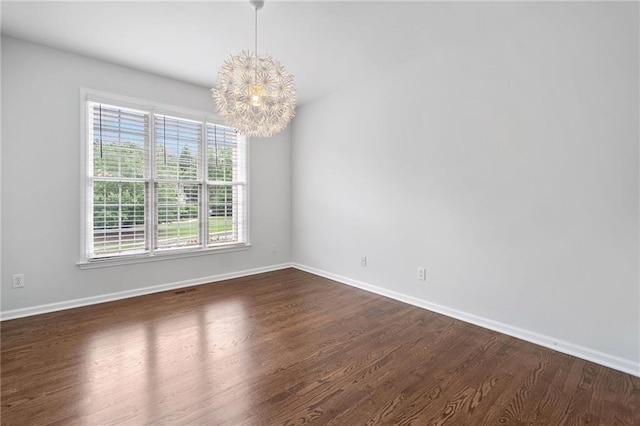 200 Glen Wood Pl, Canton, GA 30114 - spare room featuring a chandelier and dark wood-style floors
