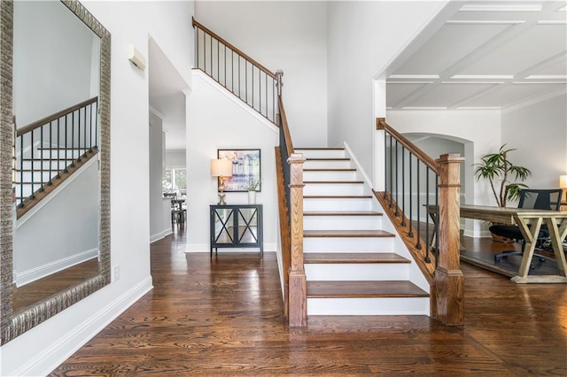 200 Glen Wood Pl, Canton, GA 30114 - stairs with wood finished floors, arched walkways, coffered ceiling, and a high ceiling