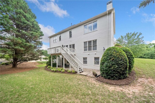 200 Glen Wood Pl, Canton, GA 30114 - back of property with a chimney, stairs, a yard, and a deck